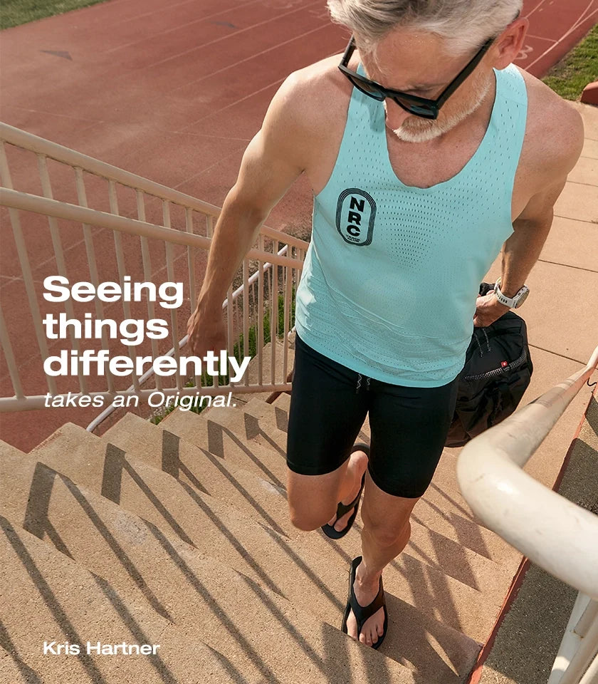 Kris Hartner wearing recovery sandals on outdoor steps